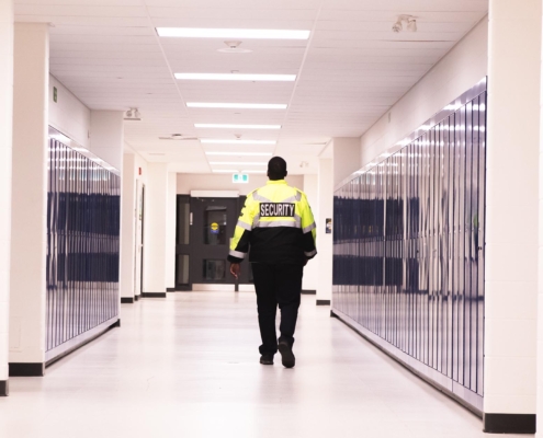 Security guard patrolling halls at school