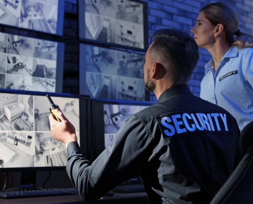 Security guards watching camera feed